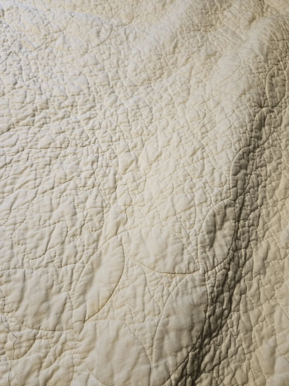 White Quilted Bedspread with Lavender and Sage Ring Pattern
